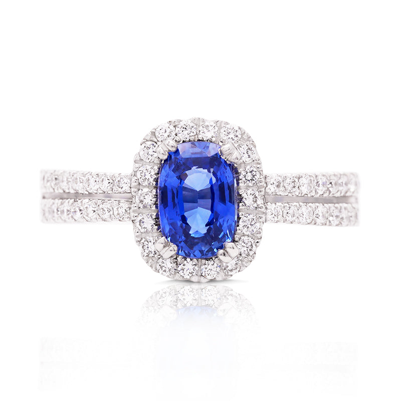 18 Carat White Gold Oval Sapphire and Diamond Halo Ring