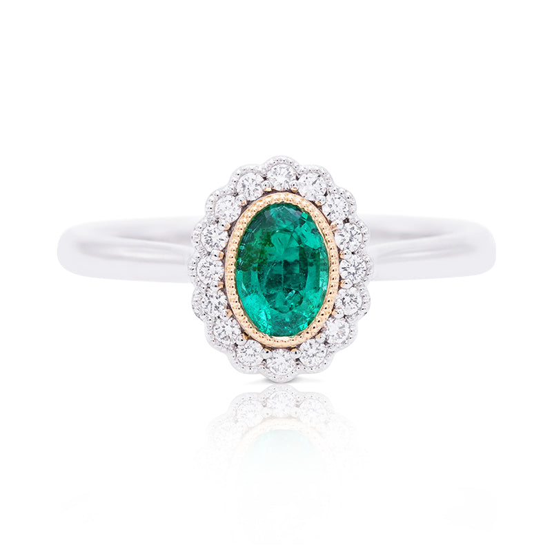 Platinum and 18 Carat Yellow Gold Emerald and Diamond Halo Ring