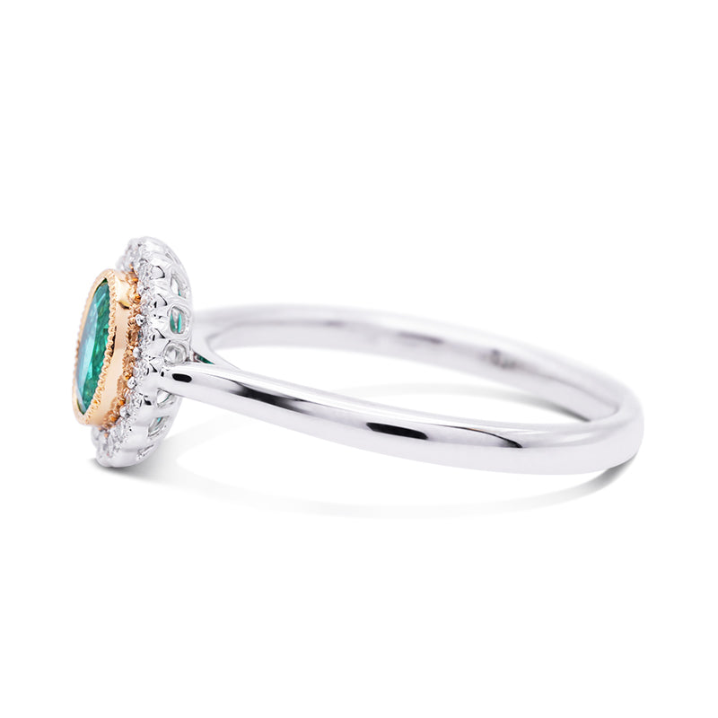 Platinum and 18 Carat Yellow Gold Emerald and Diamond Halo Ring