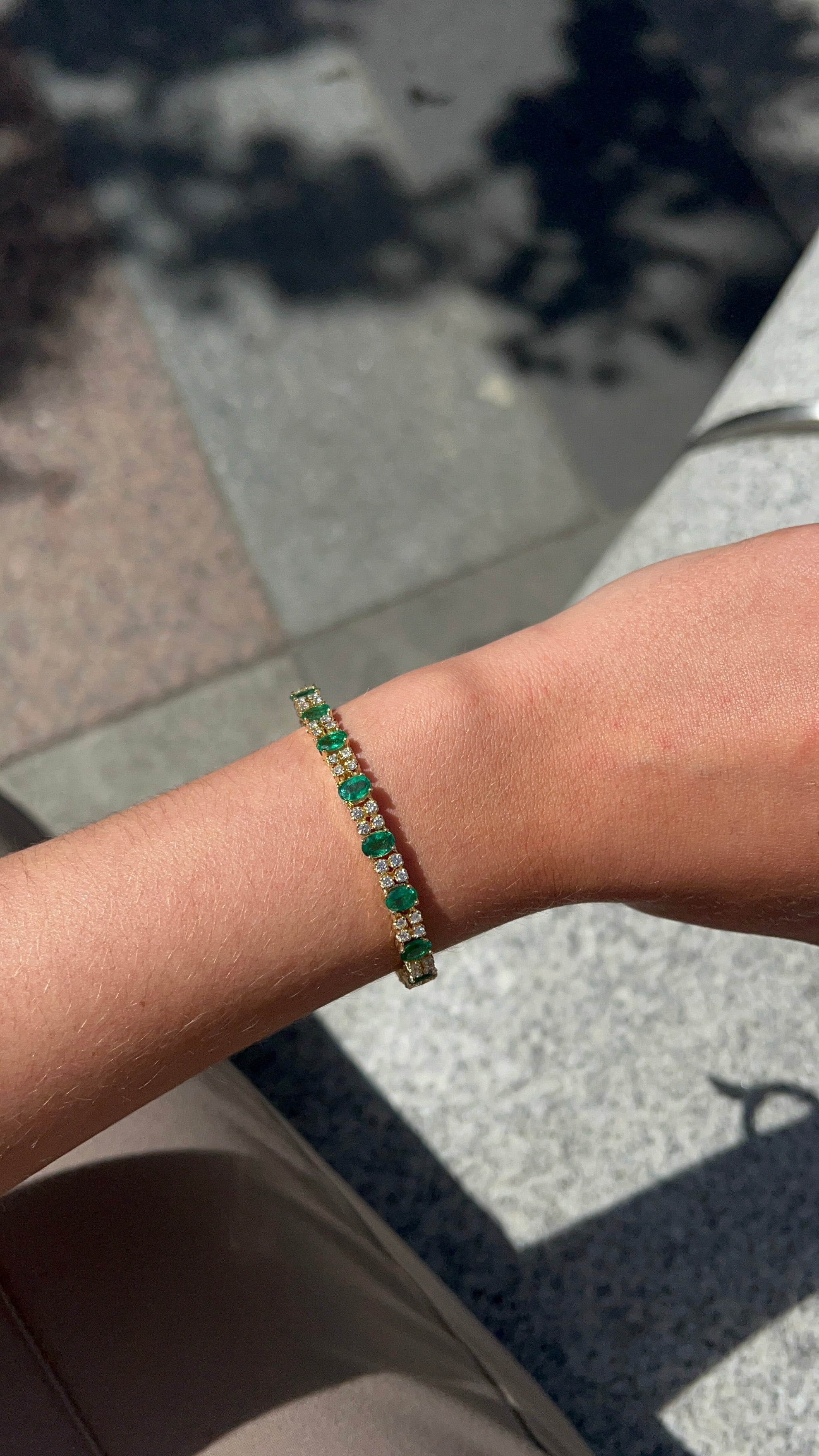 18 Carat Yellow Gold Emerald and Diamond Tennis Bracelet