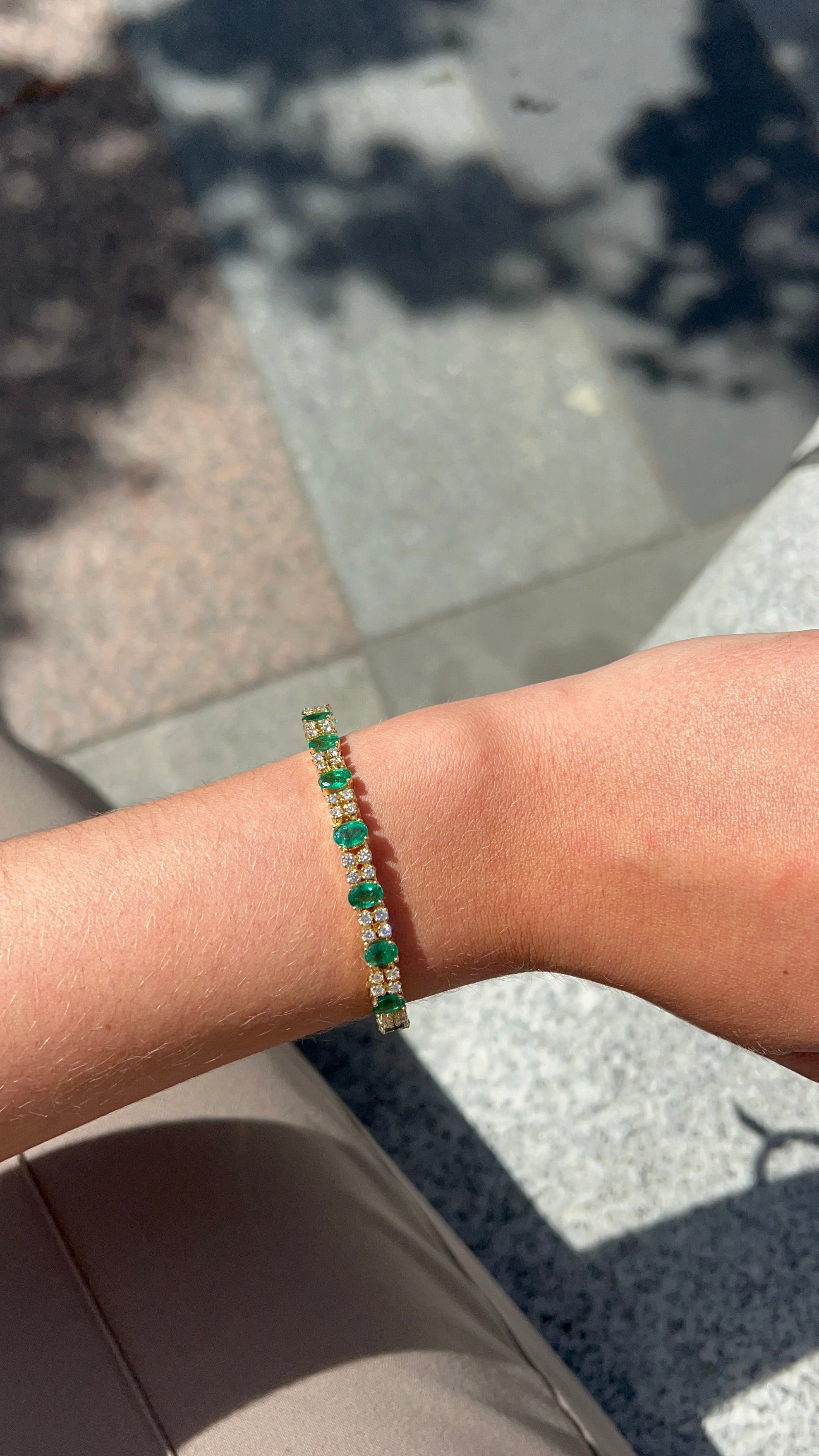 18 Carat Yellow Gold Emerald and Diamond Tennis Bracelet