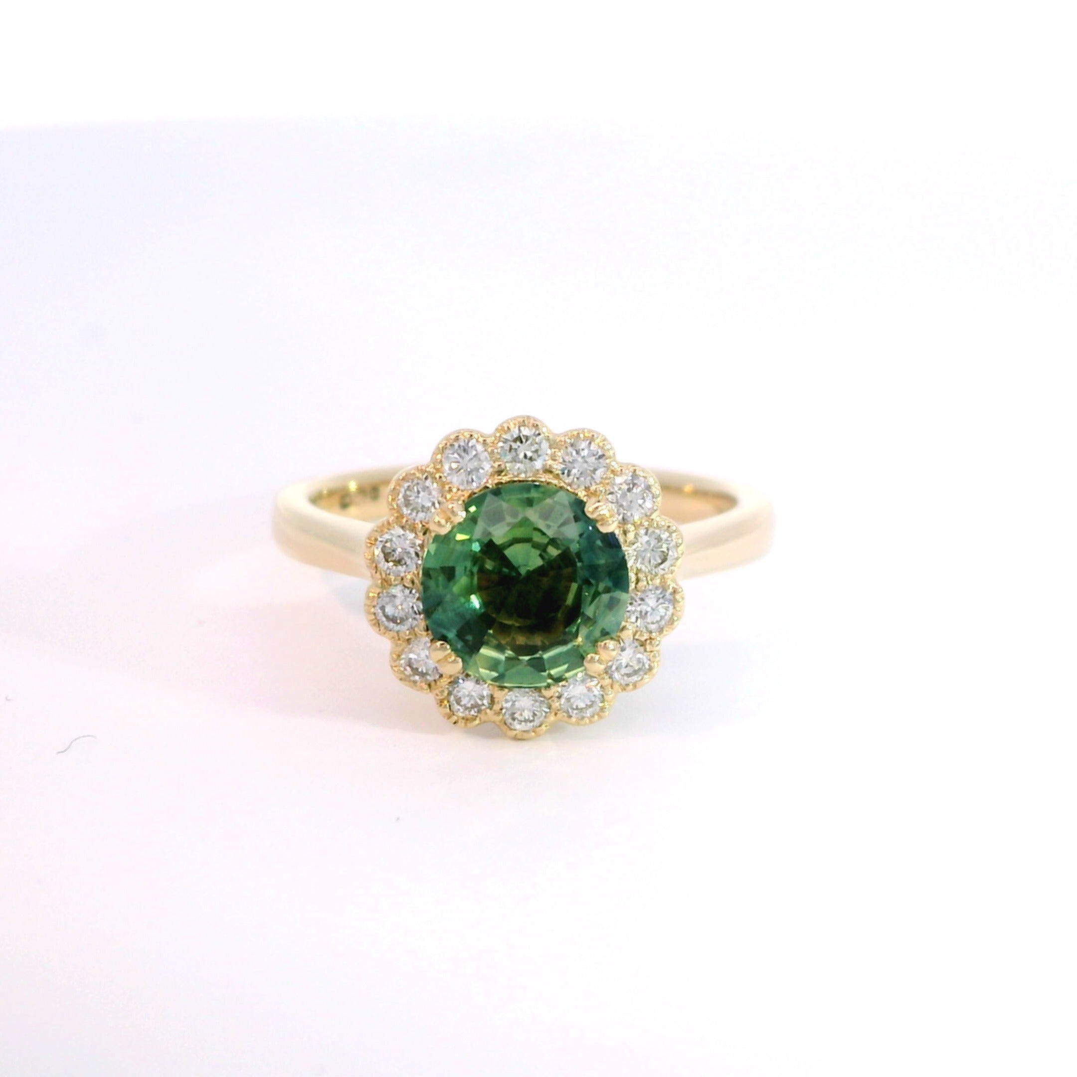 18 Carat Yellow Gold Green Sapphire and Diamond Halo Ring