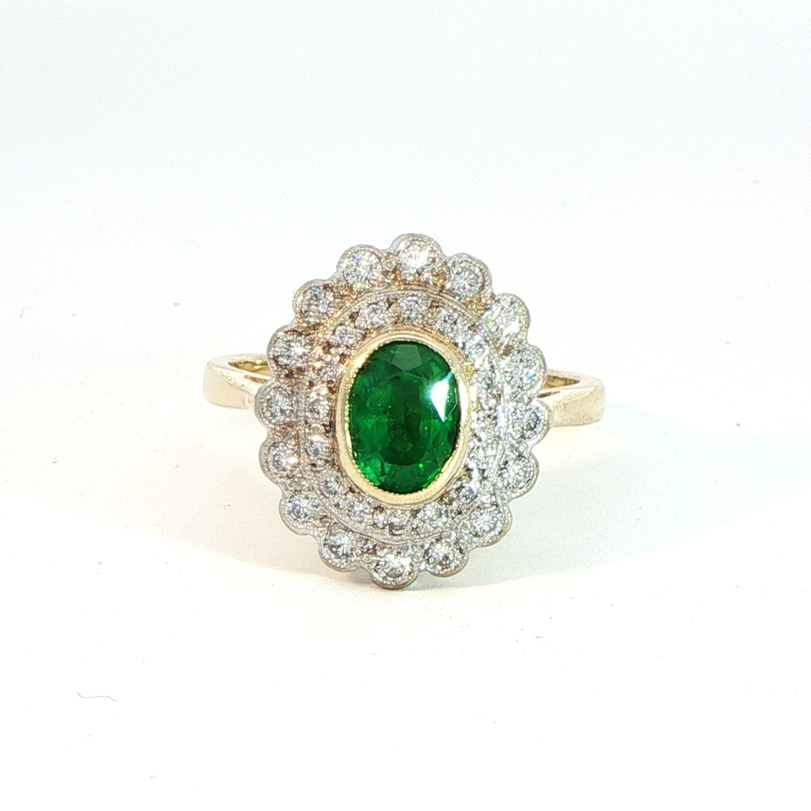 18 Carat Yellow Gold Emerald and Diamond Halo Ring