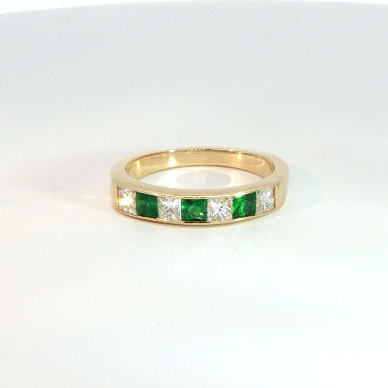 18 Carat Yellow Gold Emerald and Diamond Half Eternity Ring