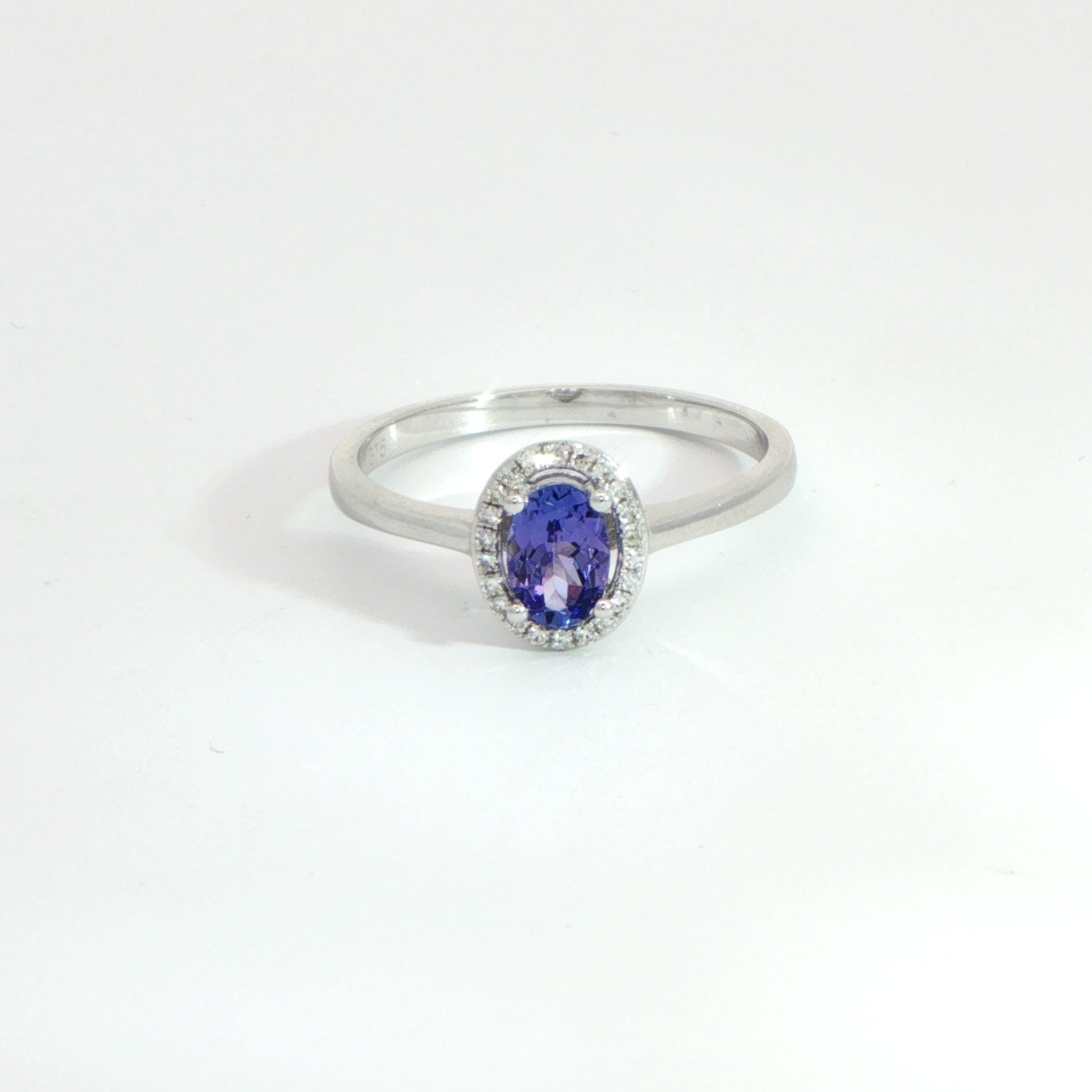 9 Carat White Gold Tanzanite and Diamond Halo Ring