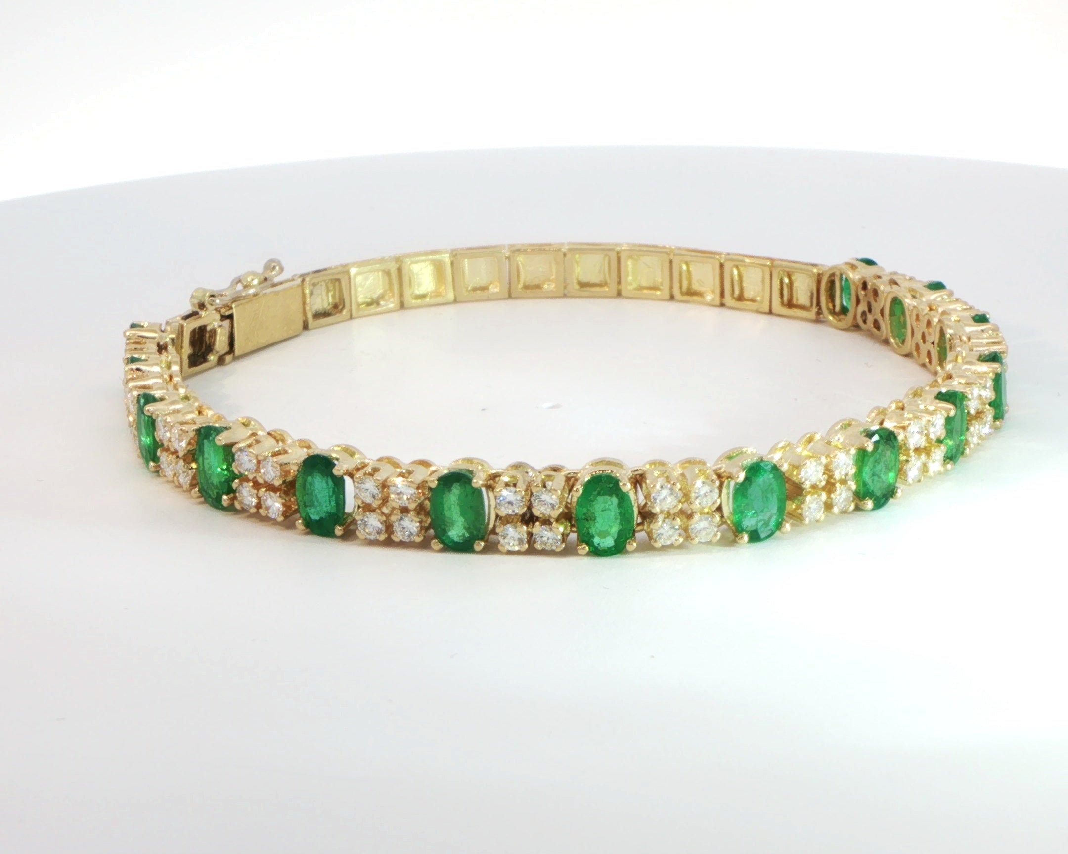 18 Carat Yellow Gold Emerald and Diamond Tennis Bracelet