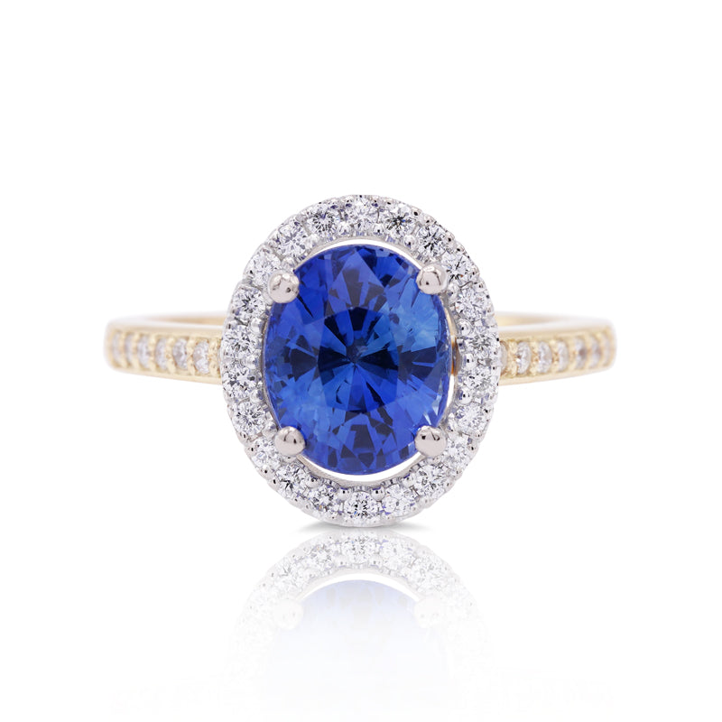 18 Carat White & Yellow Gold Oval 3.00ct Sapphire and Diamond Halo Ring