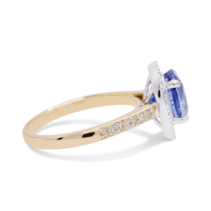 18 Carat White & Yellow Gold Oval 3.00ct Sapphire and Diamond Halo Ring