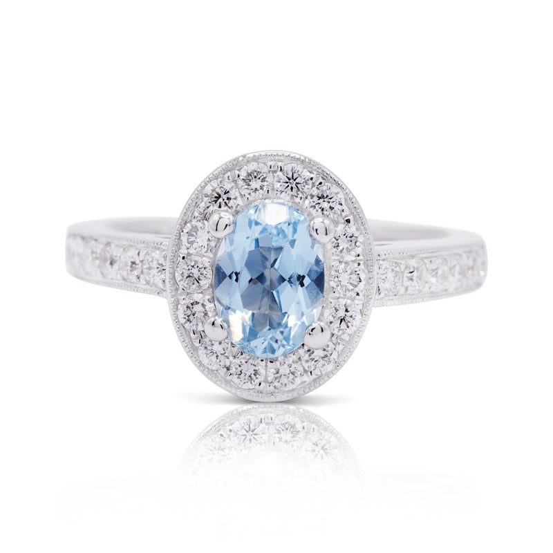 18 Carat White Gold Oval 1.00ct Aquamarine & Diamond Halo Ring