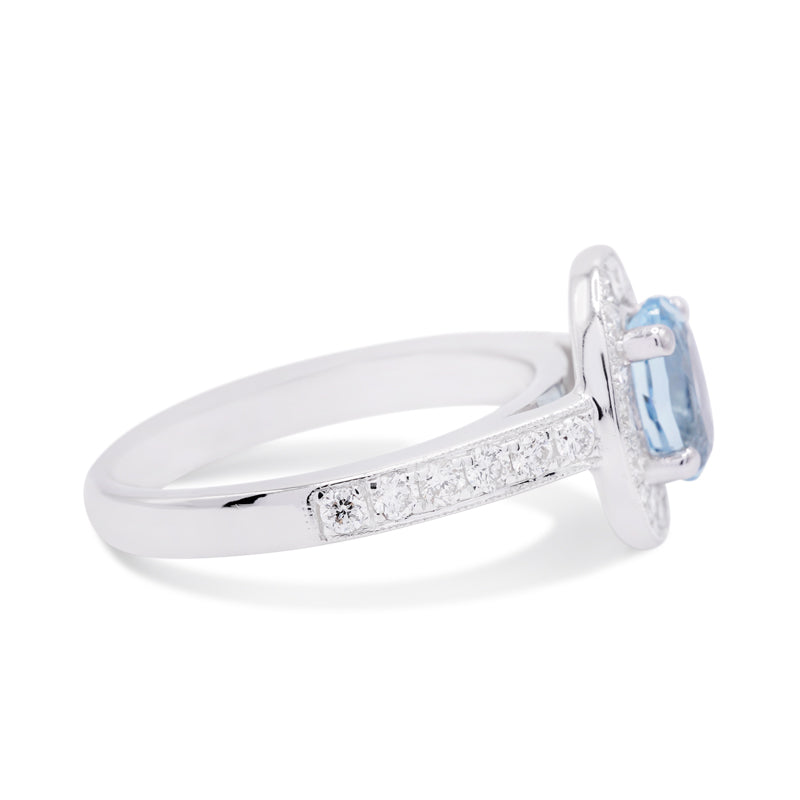 18 Carat White Gold Oval 1.00ct Aquamarine & Diamond Halo Ring