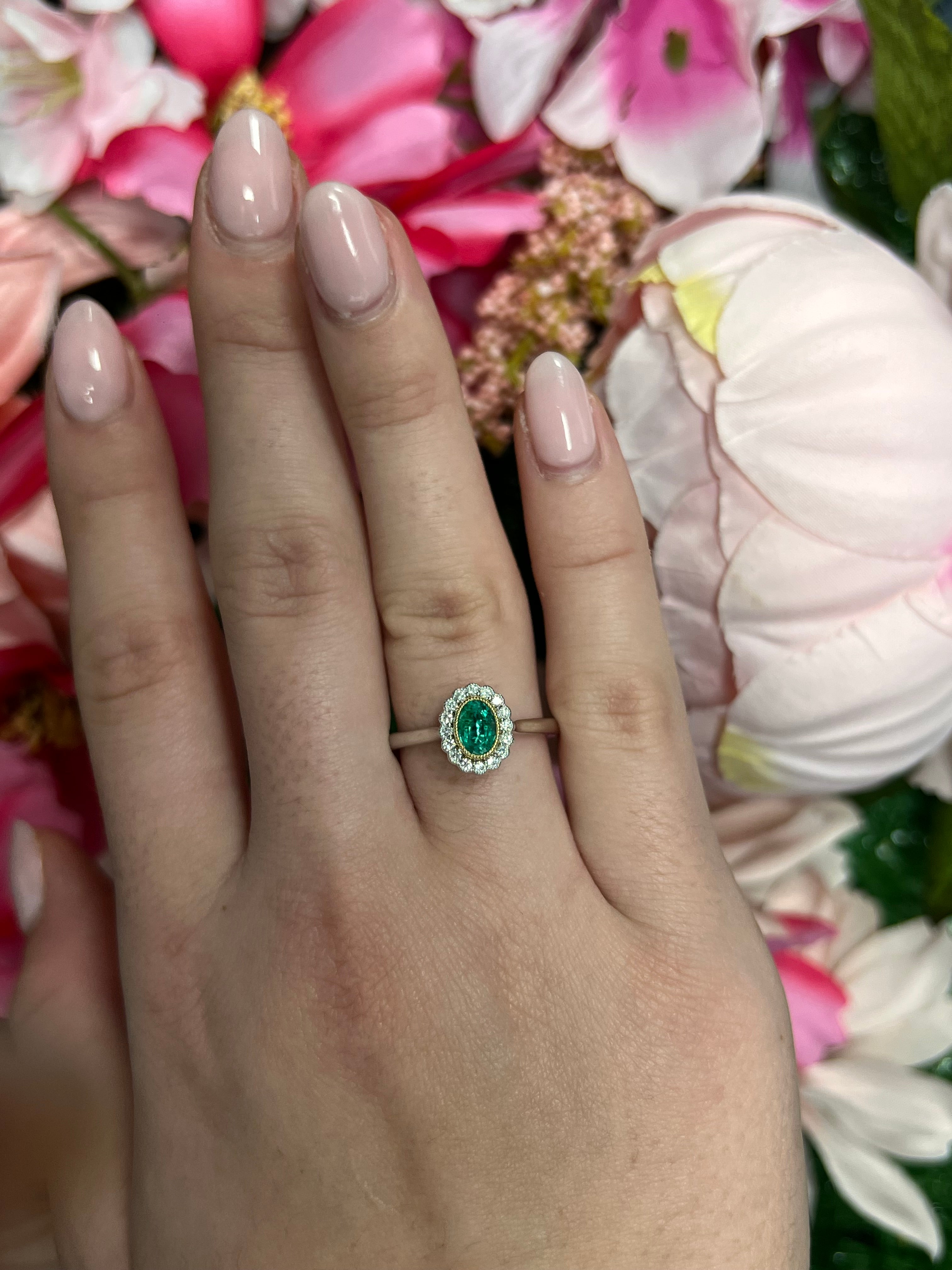 Platinum and 18 Carat Yellow Gold Emerald and Diamond Halo Ring