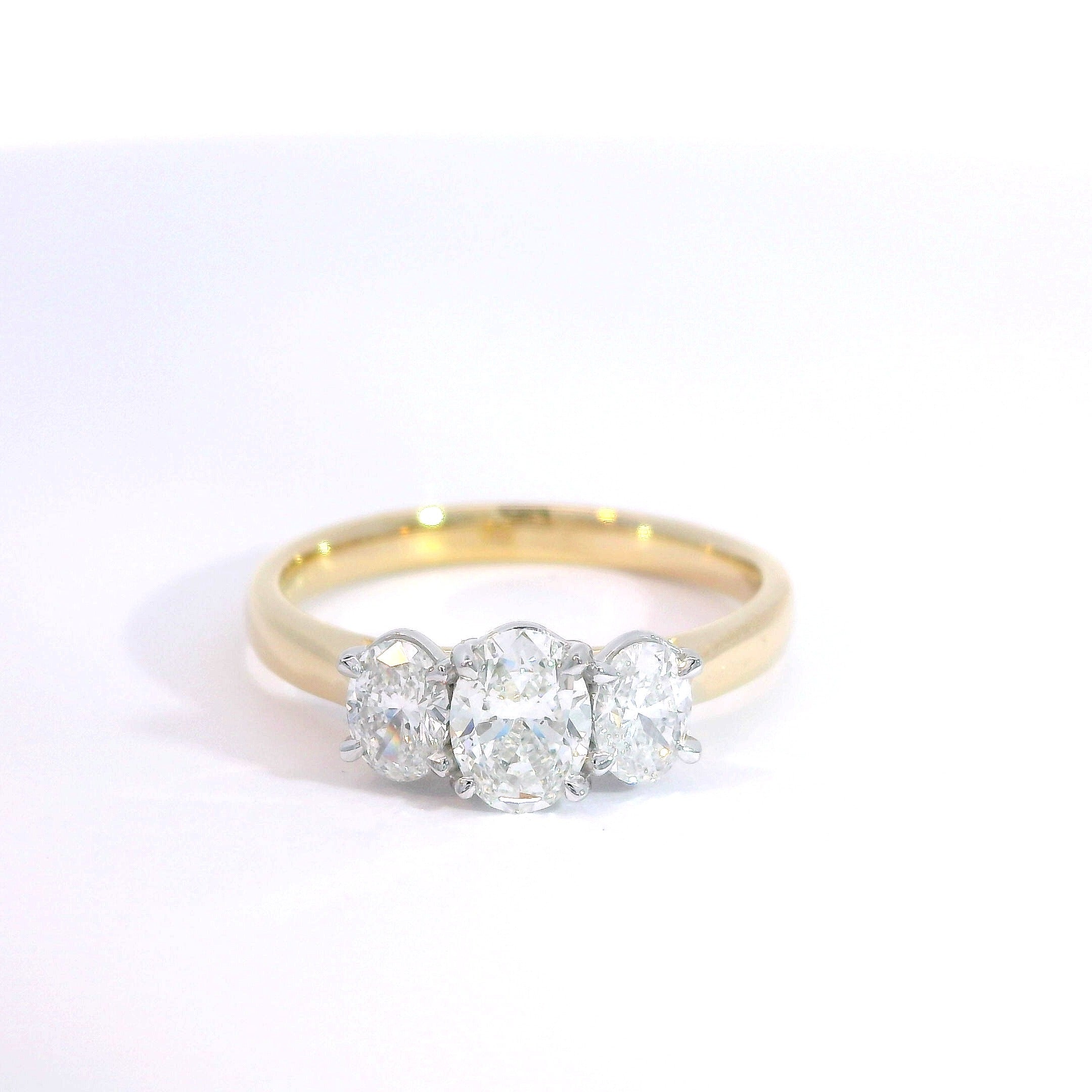 18 Carat Yellow Gold and Platinum Oval Diamond Trilogy Ring