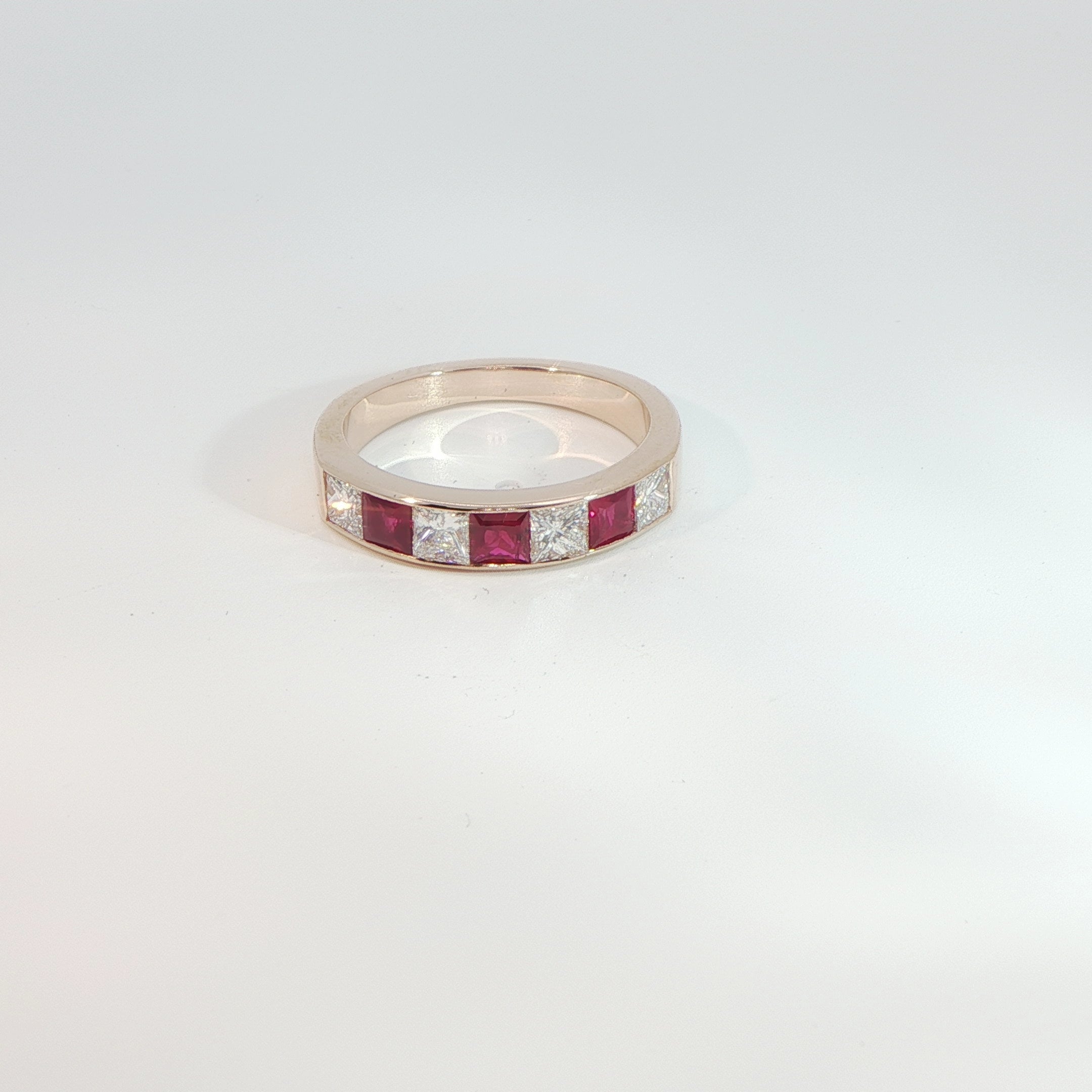 18 Carat Rose Gold Ruby and Diamond Half Eternity Ring