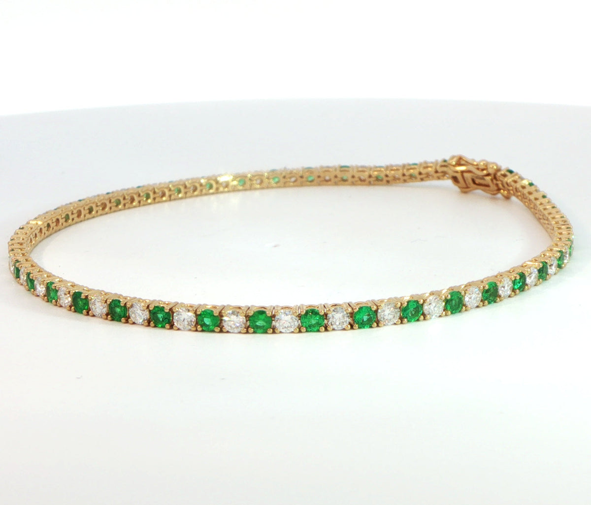 18 Carat Yellow Gold Emerald and Diamond Line Bracelet